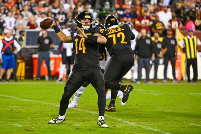 Charles Leno (72) blocks while Sam Howell (14) gets ready to throw the ball.